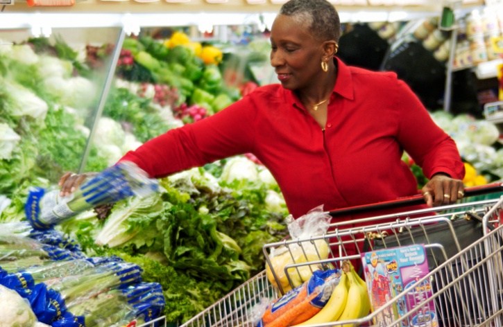 Older African American Black woman grocery shopping